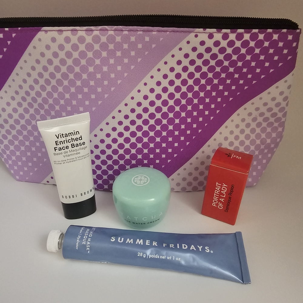 Purple and White Cosmetic Bag with Skincare Products